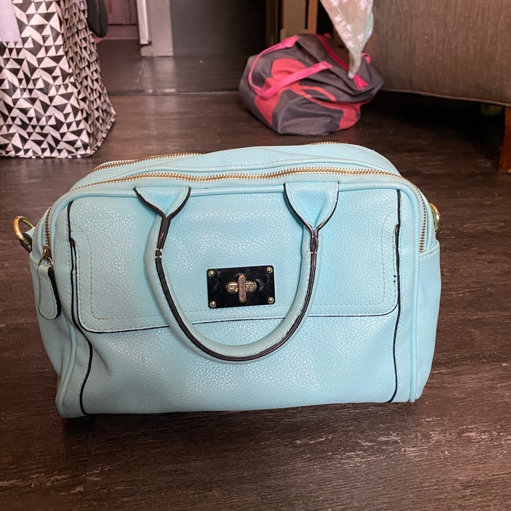 Light blue Merona purse with polka dots on the inside
